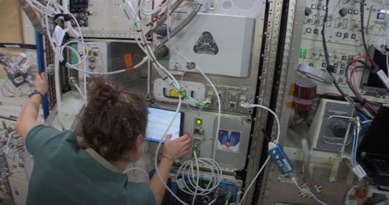 NASA astronaut Jessica Meir installing SpaceChain's blockchain hardware on the ISS