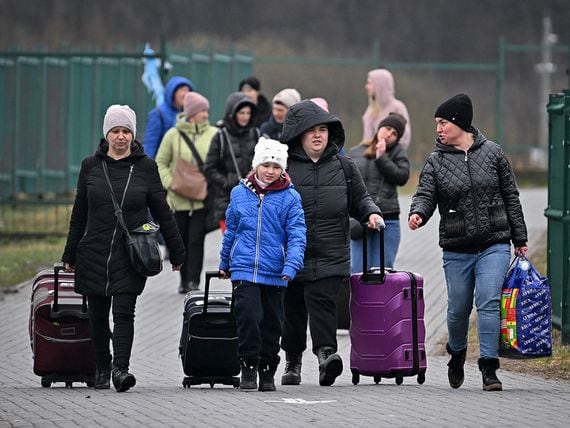 Refugees and volunteers at Medyka border crossing as people pass through from war-torn Ukraine on April 01, 2022 in Medyka, Poland. (Photo by Jeff J Mitchell/Getty Images)
