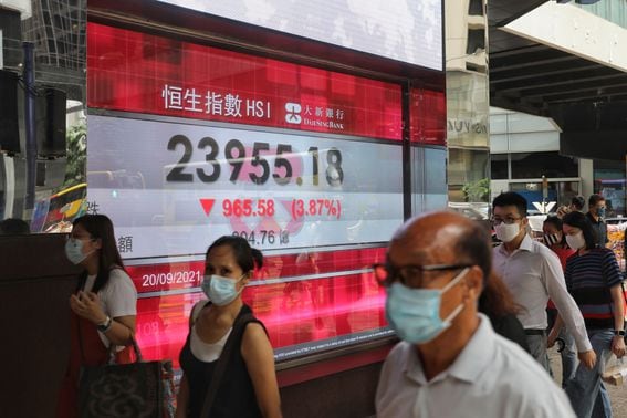 An electronic screen displays the Hang Seng Index in the Central district of Hong Kong, China Monday, Sept. 20, 2021.