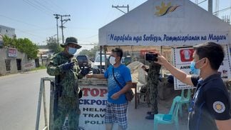 A checkpoint in Tuguegarao City, the Philippines. Via the Philippine Information Agency
