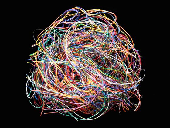 Tangled ball of colored wires against black