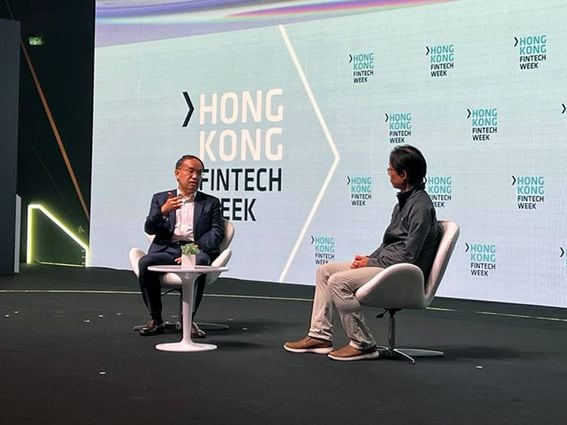 Hong Kong FSTB Secretary Christopher Hui talks to co-founder of Animoca Brands Yat Siu at Hong Kong FinTech Week. (Lavender Au/CoinDesk)