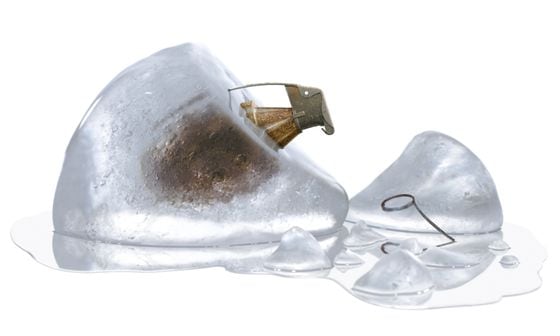 Ethereum difficulty bomb represented by unpinned grenade in melting ice, isolated on white background