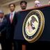 CDCROP: A US Department of Justice seal is displayed on a podium during a news conference (Ramin Talaie/Getty Images)