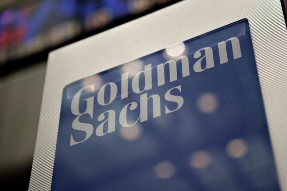 A Goldman Sachs Group Inc. logo hangs on the floor of the New York Stock Exchange in New York, U.S., on Wednesday, May 19, 2010. Goldman Sachs Group Inc. racked up trading profits for itself every day last quarter. Clients who followed the firm's investment advice fared far worse. Photographer: Daniel Acker/Bloomberg via Getty Images