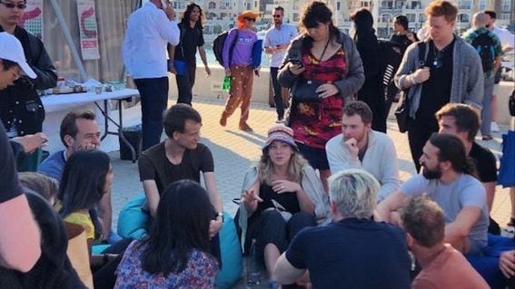 Discussion circle at Zuzalu, with Ethereum co-founder Vitalik Buterin on the turquoise beanbag chair, listening to Asymmetry Finance's Hannah Hamilton. (Adrian Guerrera)