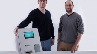 Brothers and co-founders Zach and Josh Harvey with a Lamassu ATM.