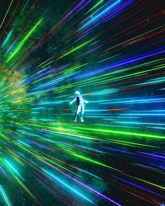 Digital photo of a person suspended in the middle of a galaxy with lights beaming behind them.