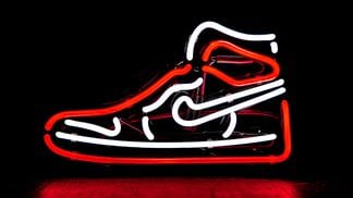 NIKE high top sneaker in neon lights (Unsplash)