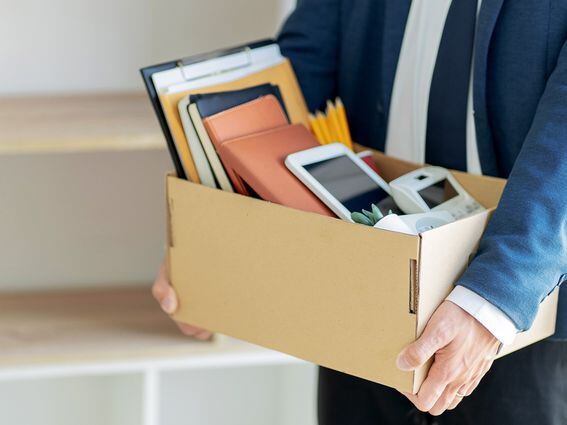 CDCROP: Stressful businessman packing a box for quit a job. (Getty Images)