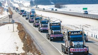 Truckers in central Alberta on their way to the Legislature Building in Edmonton (Naomi Mckinney/Unsplash)