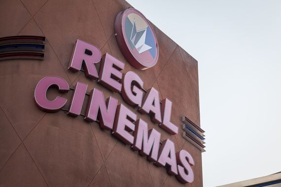 Signage is displayed on a Regal Cinemas movie theater in Oakland, California, U.S., on Tuesday, Oct. 6, 2020. More than 7,000 movie screens will be dark in the U.S. this weekend as the Regal theater chain said it will shut down all 536 locations on Thursday. Photographer: David Paul Morris/Bloomberg via Getty Images