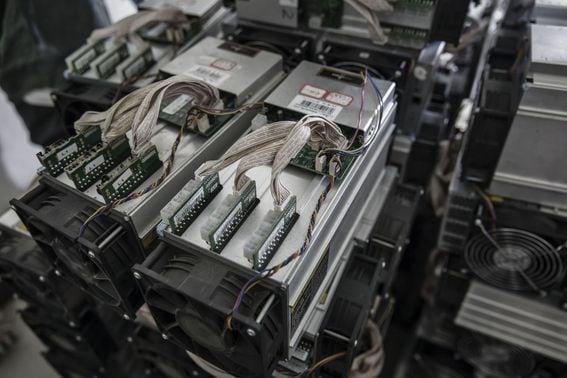 Bitcoin mining machines under repair sit at a mining facility operated by Bitmain Technologies Ltd. in Ordos, Inner Mongolia