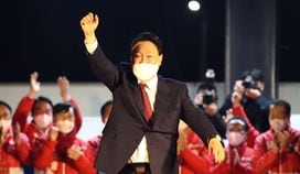 South Korean President-elect Yoon Suk-yeol of the main opposition People Power Party celebrates with supporters at the party's headquarters on March 10, 2022 in Seoul, South Korea. (Chung Sung-Jun/Getty Images)
