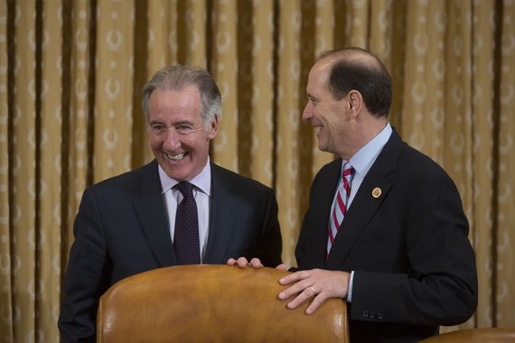 Representative Dave Camp, a Republican from Michigan and chairman of the House Ways and Means Committee, right, talks to Representative Richard Neal, a Democrat from Massachusetts, prior to a hearing in Washington, D.C., U.S., on Tuesday, Oct. 29, 2013. The official most responsible for the rollout of the Obamacare health-insurance exchange, Marilyn Tavenner, blamed a "subset" of outside contractors for the website woes, not her staff, in testimony before a U.S. House committee. Photographer: Andrew Harrer/Bloomberg via Getty Images 