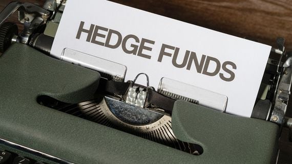Typewriter with paper saying "HEDGE FUNDS"