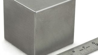 This four-inch tungsten cube weighs as much as those ridiculously huge dumbells at the far end of the rack – a whopping 40 pounds. (Midwest Tungsten)