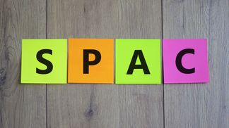 spac-special-purpose-acquisition-company-symbol-colored-papers-with-word-spac-on-beautiful-wooden-background-copy-space-business-and-spac-special-purpose-acquisition-company-concept