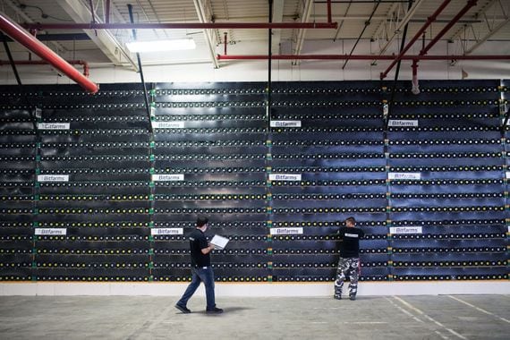 Technicians monitor cryptocurrency mining rigs at a Bitfarms facility in Saint-Hyacinthe, Quebec, Canada, on Thursday, July 26, 2018. Bitcoin has rallied more than 30 percent in July, shrugging off security and regulatory concerns that have plagued the virtual currency for much of this year. Photographer: James MacDonald/Bloomberg via Getty Images