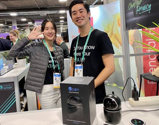 IoTeX's Dorothy Ko and Larry Pang pose at the company's booth at CES 2020. (Photo by Brady Dale for CoinDesk)