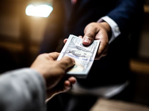 CDCROP: Man handing over money