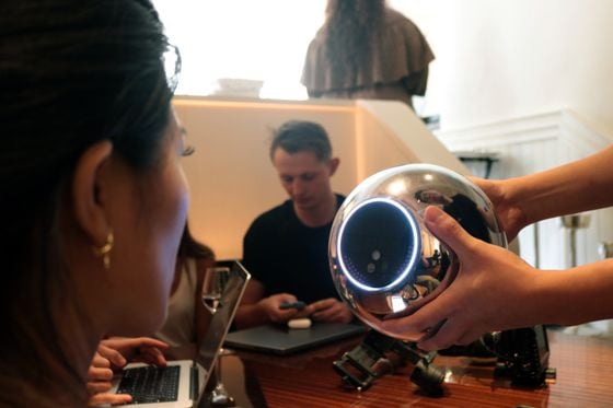 A user getting their iris scanned with a Worldcoin Orb in Paris on July 21. (Eliza Gkritsi/CoinDesk)