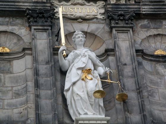 Symbol Of Justice Statue On Delft's Town Hall.South Holland