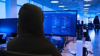 Sporting a black hoodie, the pseudonymous coder known as Proph3t works in a Salt Lake City hacker house. (Danny Nelson/CoinDesk)