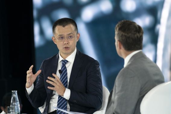 Zhao Changpeng, founder and chief executive officer of Binance, left, speaks during the Bloomberg New Economy Forum in Singapore, on Friday, Nov. 19, 2021. The New Economy Forum is being organized by Bloomberg Media Group, a division of Bloomberg LP, the parent company of Bloomberg News.
