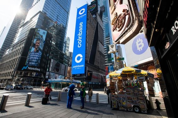 Monitors display Coinbase signage during the company's initial public offering (IPO) at the Nasdaq MarketSite in New York, U.S., on Wednesday, April 14, 2021. Coinbase Global Inc., the largest U.S. cryptocurrency exchange, is set to debut on Wednesday through a direct listing, an alternative to a traditional initial public offering that has only been deployed a handful of times. Photographer: Michael Nagle/Bloomberg via Getty Images