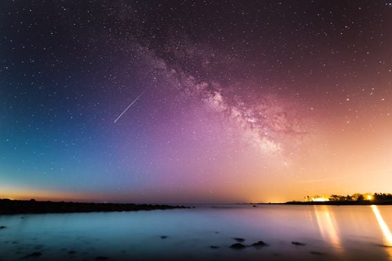 Milky Way above body of water.