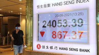 An electronic screen displays the Hang Seng Index in the Central district of Hong Kong, China Monday, Sept. 20, 2021. Growing investor angst about China's real estate crackdown rippled through markets, pummeling Hong Kong developers and adding pressure on Beijing authorities to stop financial contagion from destabilizing the economy. Photographer: Kyle Lam/Bloomberg via Getty Images