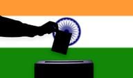 Indian flag, elections, ballot box, casting vote. (Gettyimages/btgbtg)