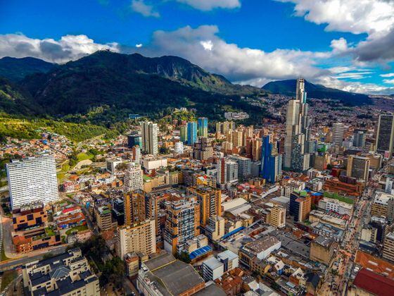 Bogota cityscape of big buildings and mountains and blue sky