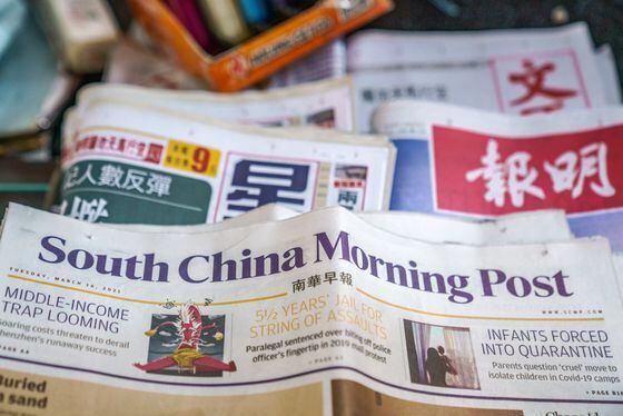 A copy of the South China Morning Post (SCMP) newspaper is arranged at a newsstand in Hong Kong, China, on Tuesday, March 16, 2021. The Chinese government wants Alibaba Group Holding Ltd. to sell some of its media assets, including the South China Morning Post, because of growing concerns about the technology giants influence over public opinion in the country, according to a person familiar with the matter. Photographer: Lam Yik/Bloomberg via Getty Images