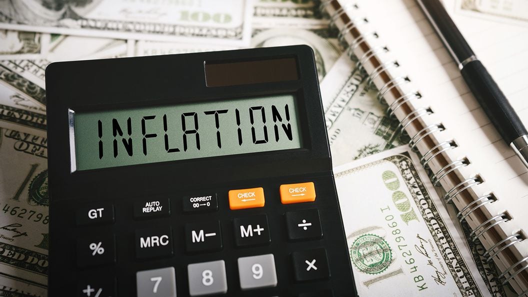 INFLATION word on calculator in idea for FED consider interest rate hike, world economics and inflation control, US dollar inflation