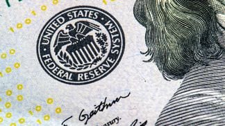 Federal Reserve stamp on a $100 bill (Oleg Golovnev/Shutterstock)