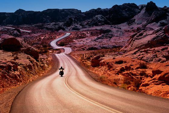Motorcyclist on Empty Road (Getty Images)