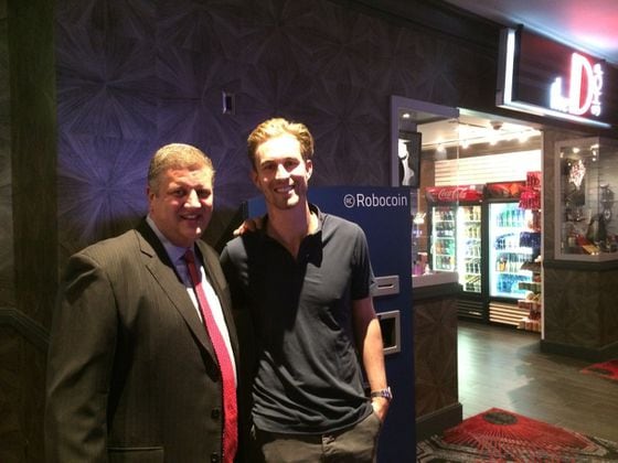  Stevens and Robocoin's Kelley next to the bitcoin ATM at the D Casino Hotel.