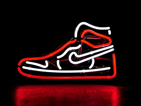 NIKE high top sneaker in neon lights (Unsplash)