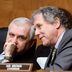 CDCROP: CDCROP: U.S. Senator Jack Reed (D -RI) confers with Senate Banking, Housing, and Urban Affairs Committee Chairman Sherrod Brown (D-OH) on Capitol Hill on March 3, 2022 in Washington, DC. (Jonathan Ernst-Pool/Getty Images)
