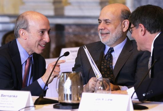 WASHINGTON, DC - DECEMBER 09:  (L-R) Chairman of the Commodity Futures Trading Commission Gary Gensler, Federal Reserve Board Chairman Ben Bernanke and U.S. Secretary of the Treasury Jacob Lew share a moment during a Financial Stability Oversight Council (FSOC) meeting December 9, 2013 at the Treasury Department in Washington, DC. Members of FSOC met to discuss cybersecurity and receive a presentation from the Office of Financial Research on financial market developments.  (Photo by Alex Wong/Getty Images)