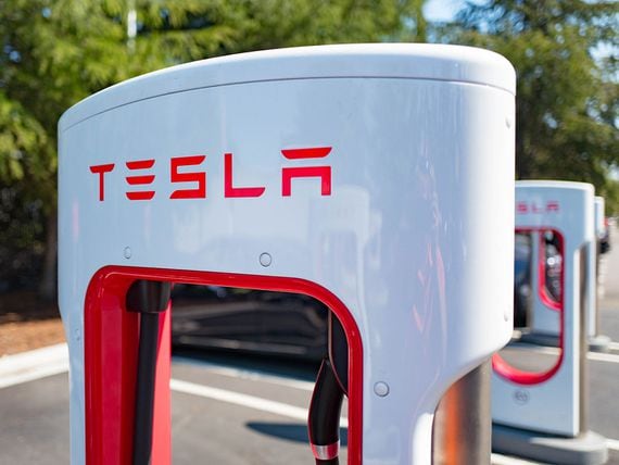 Charger with Tesla logo at a Supercharger rapid battery charging station for the electric vehicle company Tesla Motors, in the Silicon Valley town of Mountain View, California, August 24, 2016. (Photo by Smith Collection/Gado/Getty Images).