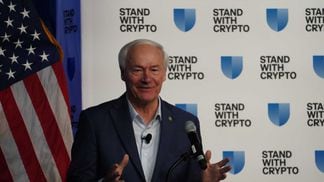 A former politician speaks at a crypto industry event run by the Coinbase-backed Stand with Crypto Alliance on Dec. 11. (NIK de / CoinDesk)