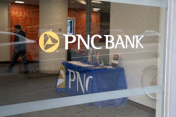 Signage on a window at a PNC Bank branch in Washington, D.C.