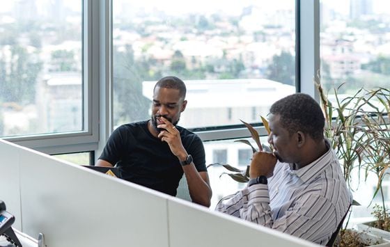 CEO Yele Bademosi and CTO Taiwo Orilogbon discuss business at the Bundle offices.