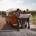 CDCROP: Friends on a road trip looking at a map lost (Image Source/Getty Images)