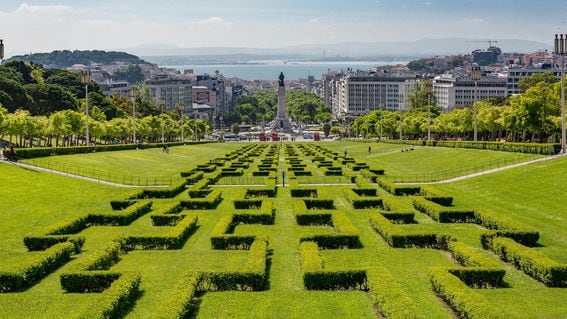 Stunning view of Lisbon from a manicured green lawn in foreground to the sea on the horizon (Sally Wilson/Pixabay)