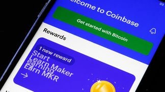 Coinbase downgraded at D.A. Davidson (Chesnot/Getty Images)