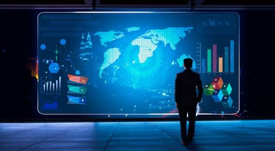 Business man looking financial graph icon on futuristic virtual screen with technology